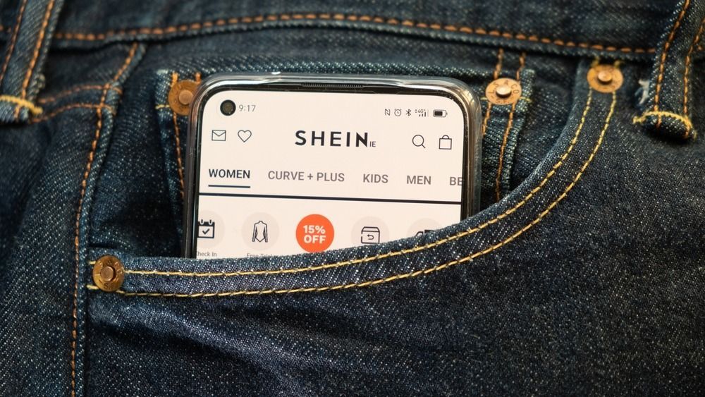 Smartphone,In,The,Front,Pocket,Of,A,Jean,,On,The, 
Shein