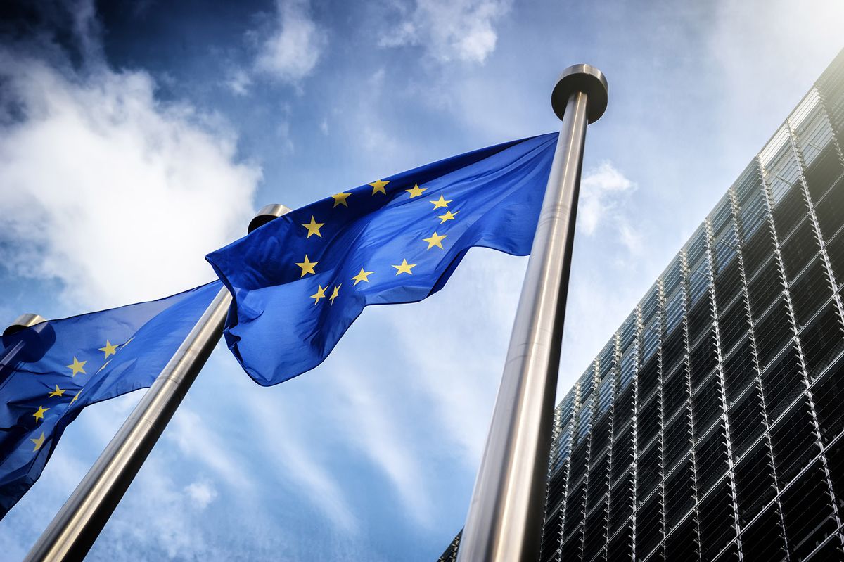 European,Union,Flags,On,Blue,Sky,Background