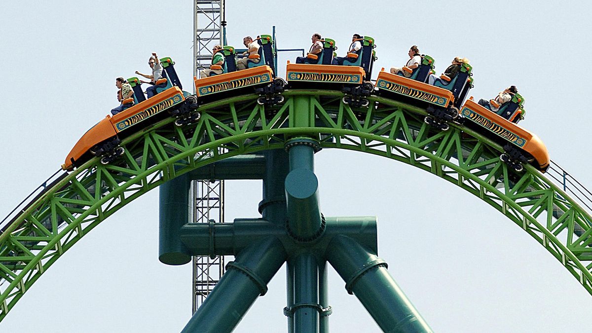 COASTING TO A WHITE-KNUCKLE WORLD RECORD Riders reach the summit of the "Kingda Ka" roller coaster 19 May, 2005, at Six Flags amusement park in Jackson, New Jersey. The monster ride uses a hydraulic launch system to slingshot riders horizontally from 0 to 205 kilometers (128 miles) per hour in 3.5 seconds. The momentum flings the 18-seater train into a 90 degree climb to a height of 139 meters (456 feet), followed by a vertical plunge through a three-quarter spiral and a final jaunt over a 39-meter (129-foot) high "camel hump." AFP PHOTO/Stan HONDA (Photo by STAN HONDA / AFP)