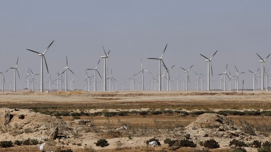 This picture taken on September 14, 2022 shows a view of windmills at the onshore Zaafarana windfarm (producing a total capacity of 544.82 megawatts) along the gulf of Suez on Egypt's Red Sea coast, about 110 kilometres south of Suez. (Photo by Khaled DESOUKI / AFP)