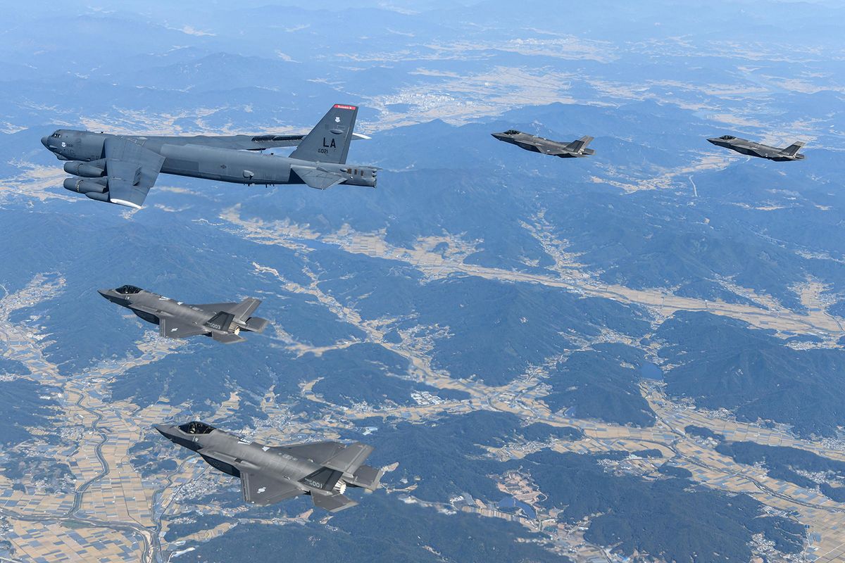 This handout photo taken on October 17, 2023 and provided by the South Korean Defence Ministry shows a US Air Force B-52H strategic bomber (C) flying with South Korean Air Force F-35A fighter jets during a joint air drill in South Korea. (Photo by Handout / South Korean Defence Ministry / AFP) / RESTRICTED TO EDITORIAL USE - MANDATORY CREDIT "AFP PHOTO / SOUTH KOREAN DEFENCE MINISTRY" - NO MARKETING NO ADVERTISING CAMPAIGNS - DISTRIBUTED AS A SERVICE TO CLIENTS