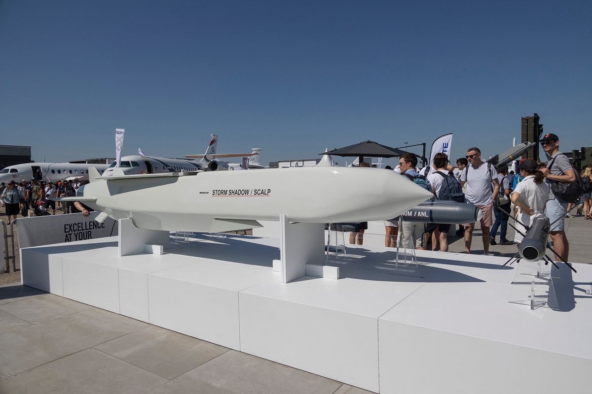 SCALP Missile At Paris Air Show
Visitors are gathered around a SCALP EG / STORM SHADOW low-observable, long-range air-launched cruise missile, an air to surface weapon from the European manufacturer MBDA at the company's booth at International Paris Air Show 2023 in Le Bourget Airport. The Long Range Autonomous Cruise Missile System carries a warhead with a unit cost around 2.500.000 USD. Next to the SCALP EG system are other like  BRIMESTONE, SPEAR, SEA VENOM / ANL, AKERON LP. Paris, France on June 2023 (Photo by Nicolas Economou/NurPhoto) (Photo by Nicolas Economou / NurPhoto / NurPhoto via AFP)