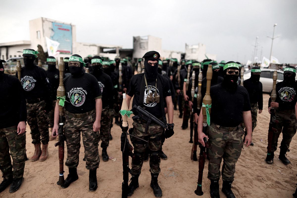 GAZA CITY, GAZA - DECEMBER 14:  Palestinian Hamas movement organized on Sunday an elaborate military parade in Gaza City to commemorate the passage of 27 years since its foundation. Hundreds of masked fighters from the group's military wing, the Ezzedin Al-Qassam Brigades, marched through the city's main roads holding locally-manufactured and other rifles as well as mortar shells. (Mustafa Hassona - Anadolu Agency) (Photo by MUSTAFA HASSONA / ANADOLU AGENCY / Anadolu via AFP)