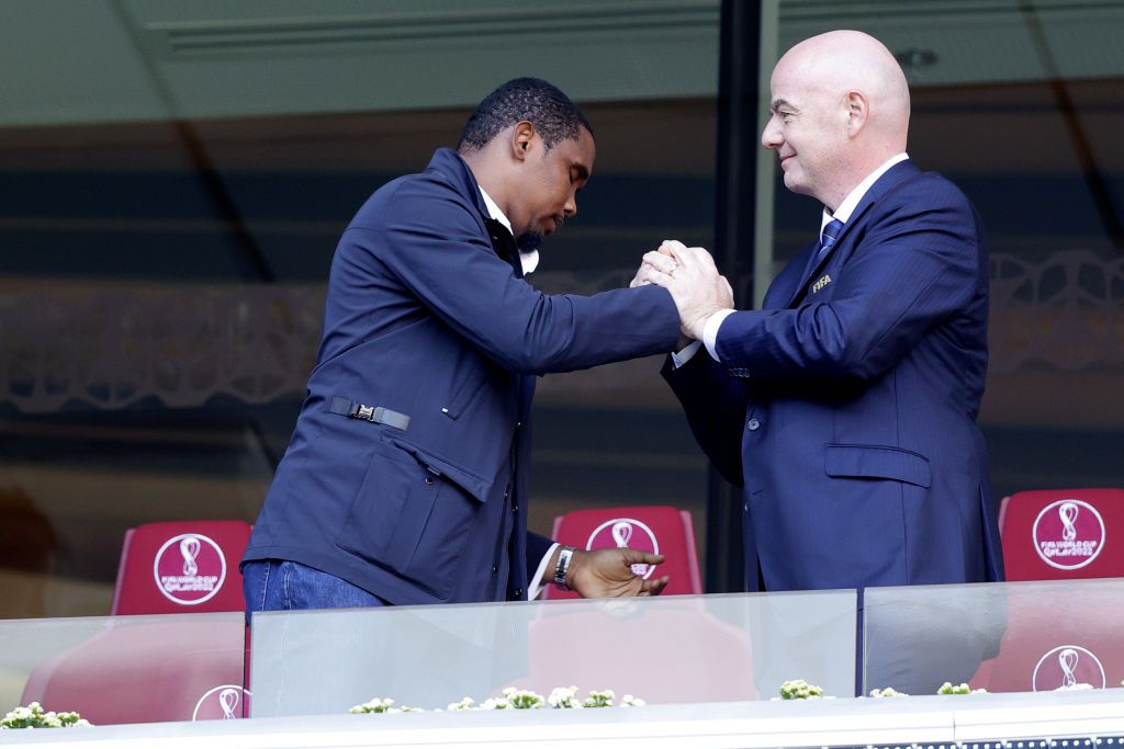 Switzerland  v Cameroon -World CupAL WAKRAH, QATAR - NOVEMBER 24: (L-R) Samuel Etoo, FIFA president Gianni Infantino during the  World Cup match between Switzerland  v Cameroon at the Al Janoub Stadium on November 24, 2022 in Al Wakrah Qatar (Photo by David S. Bustamante/Soccrates/Getty Images)