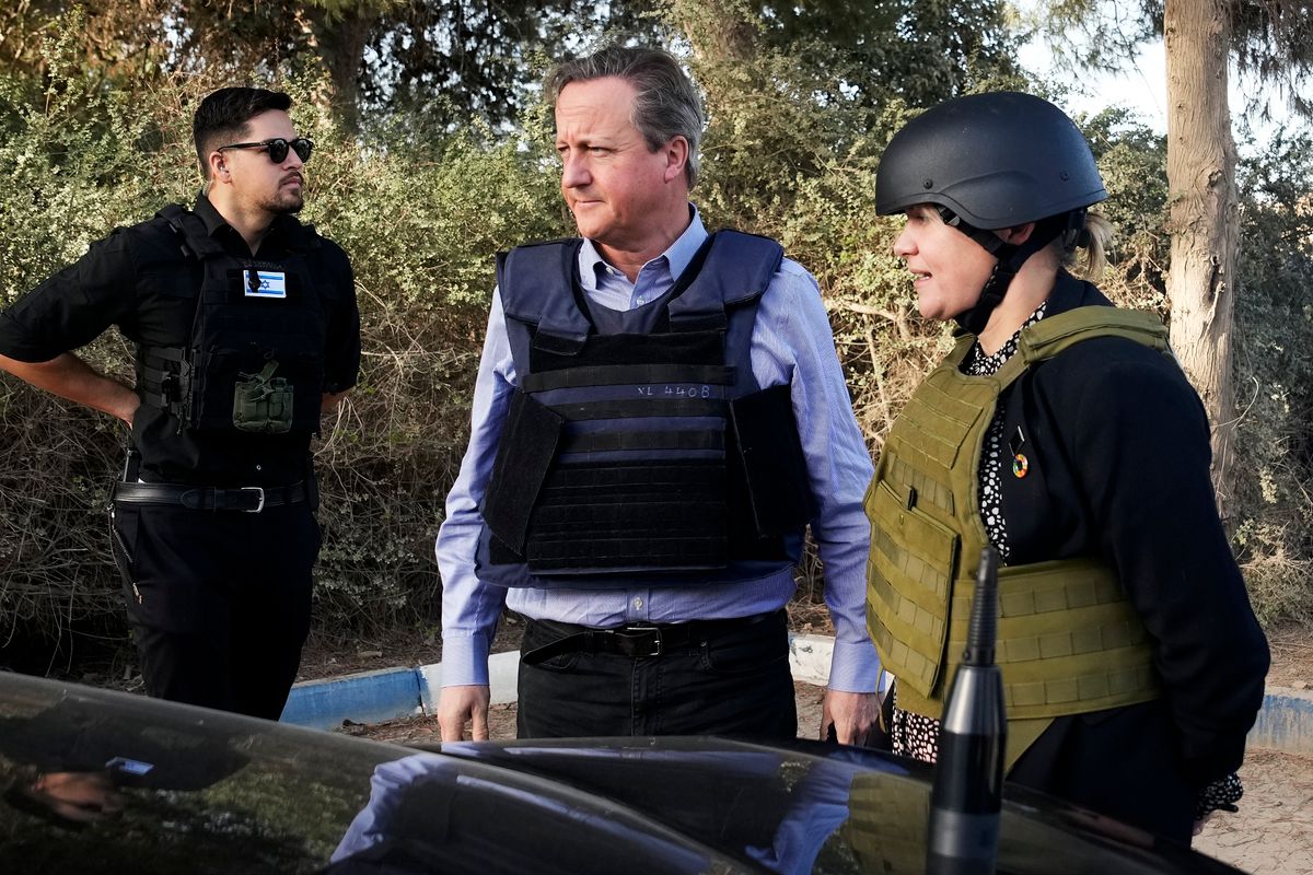 UK Foreign Secretary David Cameron Visits IsraelBE'ERI, ISRAEL - NOVEMBER 23: David Cameron (C), the new UK foreign secretary and former prime minister, views a home destroyed in last month's Hamas attack on November 23, 2023 at kibbutz Be'eri, Israel. Cameron was joined by Israeli Foreign Minister Eli Cohen on a visit to the kibbutz where scores of people were killed in the Oct. 7 attack by Hamas. His visit comes as Israel is on the brink of commencing a temporary ceasefire with Hamas, although the timing of the truce is still not confirmed. (Photo by Christopher Furlong/Getty Images)