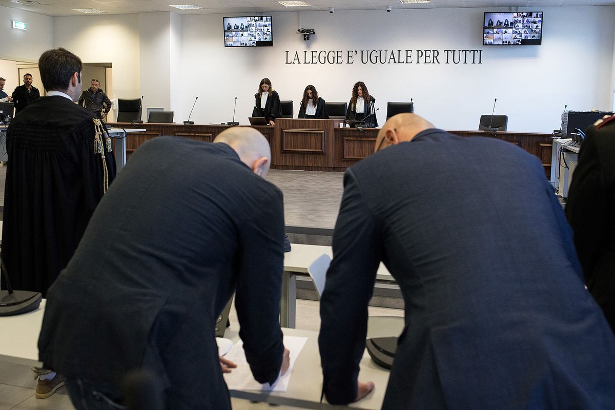 Magistrates stand during the reading of the verdict at the maxi mafia-trial in Lamezia Terme on November 20, 2023 where some 200 people were convicted in the so-called Rinascita Scott trial against alleged members of the 'Ndrangheta mafia in the Calabrian province of Vibo Valentia and the mob's white-collar facilitators. (Photo by Gianluca CHININEA / AFP)