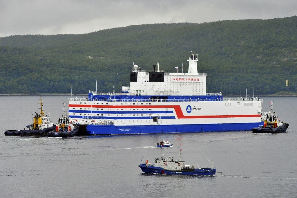 This handout picture taken and released on August 23, 2019, by the Russian nuclear agency ROSATOM shows the floating power unit (FPU) Akademik Lomonosov being towed from the Arctic port of Murmansk, northwestern Russia. Russia launched the world's first floating nuclear reactor, sending it on an epic journey across the Arctic on August 23, despite environmentalists warning of a "Chernobyl on ice." Loaded with nuclear fuel, the Akademik Lomonosov left the Arctic port of Murmansk to begin its 5,000 kilometre (3,000-mile) voyage to Pevek in northeastern Siberia. (Photo by Handout / ROSATOM / AFP) / RESTRICTED TO EDITORIAL USE - MANDATORY CREDIT "AFP PHOTO / ROSATOM / HO" - NO MARKETING NO ADVERTISING CAMPAIGNS - DISTRIBUTED AS A SERVICE TO CLIENTS
