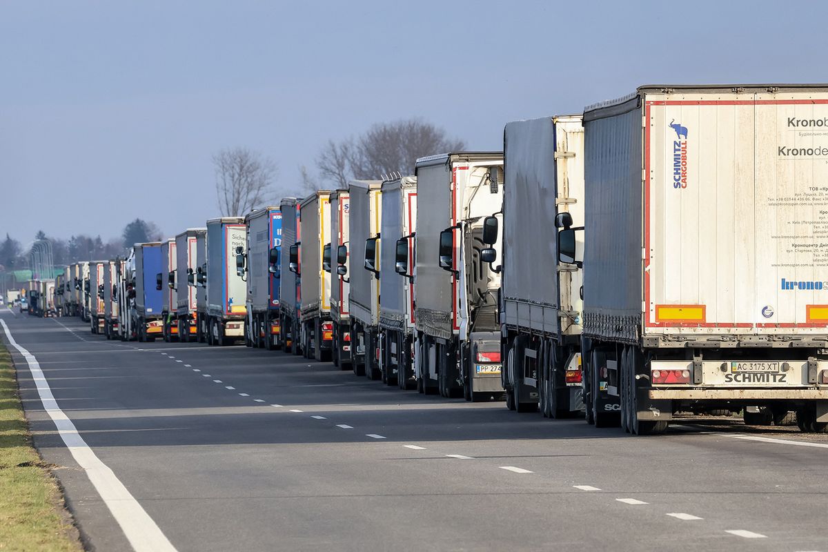 Trucks stand in a queue to cross the border in Medyka as Polish farmers start a strike and block truck transport in Medyka - border crossing between Poland and Ukraine, on November 23, 2023. The farmers joined the transport sector in their  over two weeks old strike against poor management of agricultural imports of Ukrainian produce as well as to demand renegotiation of transport deals between Ukraine and the European Union. Medyka is the fourth strike site. Protesters already blocked 3 other crossings for truck transport, allowing only 4 trucks per an hour - excluding humanitarian and military aid and sensitive chemical and food goods. According to the drivers, the queue to the Medyka crossing was nearly 7 days even before the strike started today. (Photo by Dominika Zarzycka/NurPhoto) (Photo by Dominika Zarzycka / NurPhoto / NurPhoto via AFP)