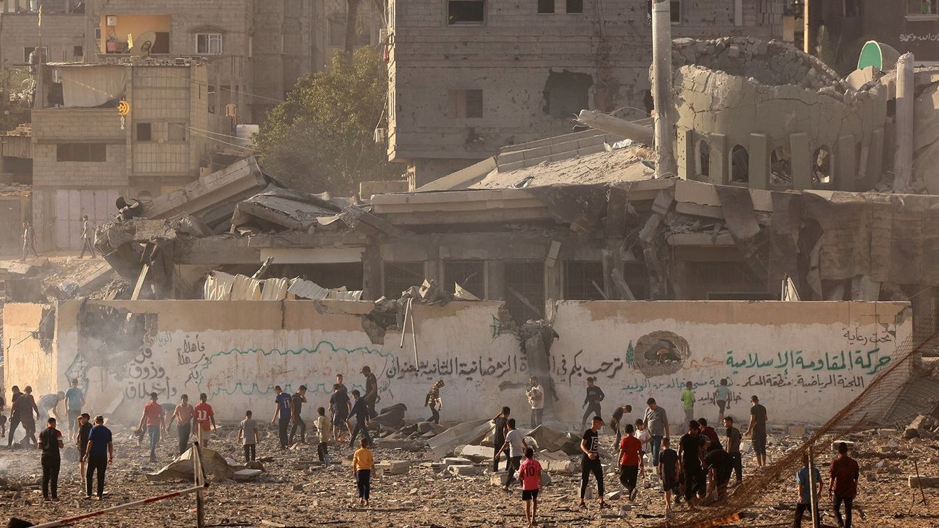 Palestinians inspect the debris at the Khaled Ibn Al-Walid mosque, after it was hit by Israeli bombardment, in Khan Yunis on November 8, 2023, amid ongoing battles between Israel and the Palestinian Hamas movement. (Photo by Mahmud HAMS / AFP)