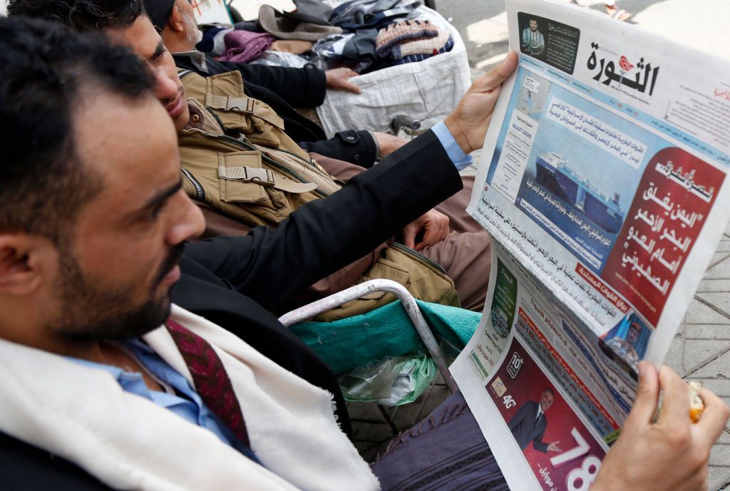 Following News About Hijacked Israeli Ship In YemenSANA'A, YEMEN - NOVEMBER 20: Yemeni men read a local newspaper carrying an article about the alleged Israeli ship hijacked by the Houthi movement in the Red Sea, at a newsagent on November 20, 2023 in Sana'a, Yemen. Yemen's Houthi movement declared on Sunday that they had seized an Israeli cargo ship in the Red Sea, following through on a prior warning. The movement had previously stated that it would target ships in international waters connected to or owned by Israel until Israel ceases its aggression and genocide in the Gaza Strip.(Photo by Mohammed Hamoud/Getty Images)