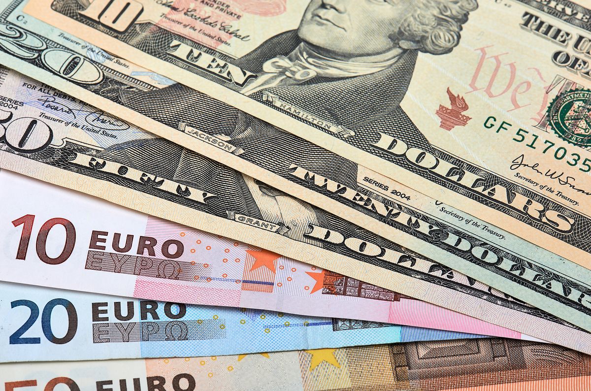 Fanned,Out,Banknotes,Of,Euros,And,Dollars.,Closeup.