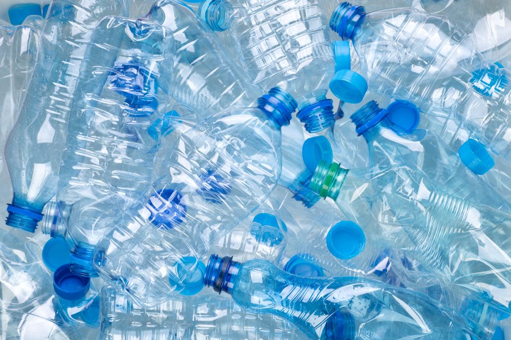 Plenty,Of,Plastic,Bottles,On,White,Background,Top,View