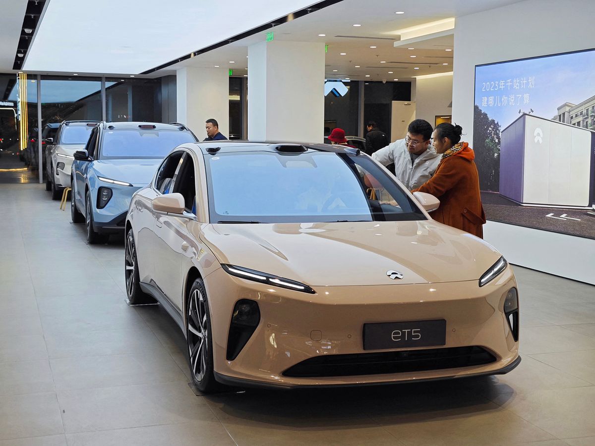 Citizens are learning about ET5 models at a NIO auto store in Yantai, Shandong province, China, on November 26, 2023. (Photo by Costfoto/NurPhoto) (Photo by CFOTO / NurPhoto / NurPhoto via AFP)