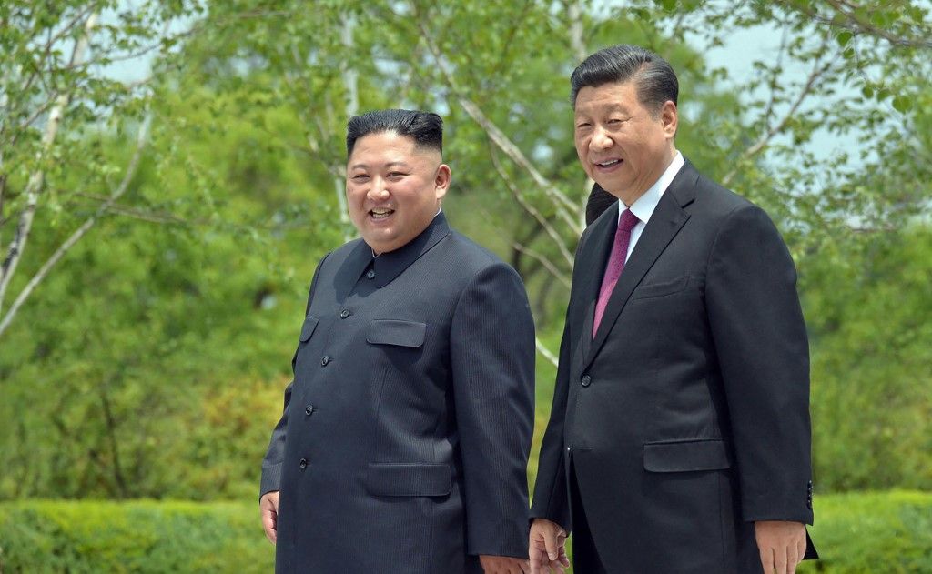This June 21, 2019 picture released from North Korea's official Korean Central News Agency (KCNA) on June 22, 2019 shows China's President Xi Jinping (R) and North Korean leader Kim Jong Un (L) walking at the Kumsusan State Guest House in Pyongyang. (Photo by KCNA VIA KNS / AFP) / South Korea OUT / ---EDITORS NOTE--- RESTRICTED TO EDITORIAL USE - MANDATORY CREDIT "AFP PHOTO/KCNA VIA KNS" - NO MARKETING NO ADVERTISING CAMPAIGNS - DISTRIBUTED AS A SERVICE TO CLIENTS / THIS PICTURE WAS MADE AVAILABLE BY A THIRD PARTY. AFP CAN NOT INDEPENDENTLY VERIFY THE AUTHENTICITY, LOCATION, DATE AND CONTENT OF THIS IMAGE --- / 