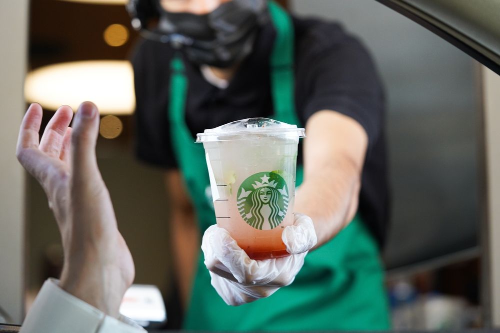 Starbucks,Workers,Give,Orders,At,The,Drive-thru.,Lemonade,Strawberry.,Saudi