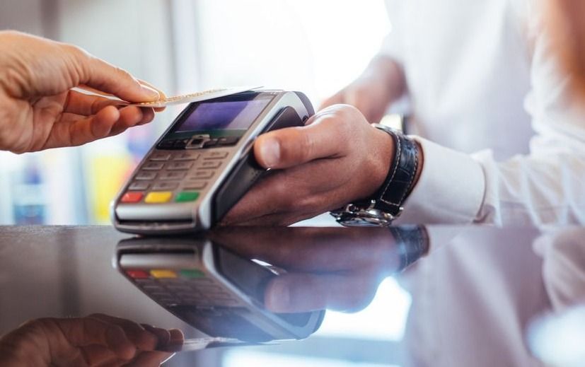 Hand,Of,Customer,Paying,With,Contactless,Credit,Card,With,Nfc