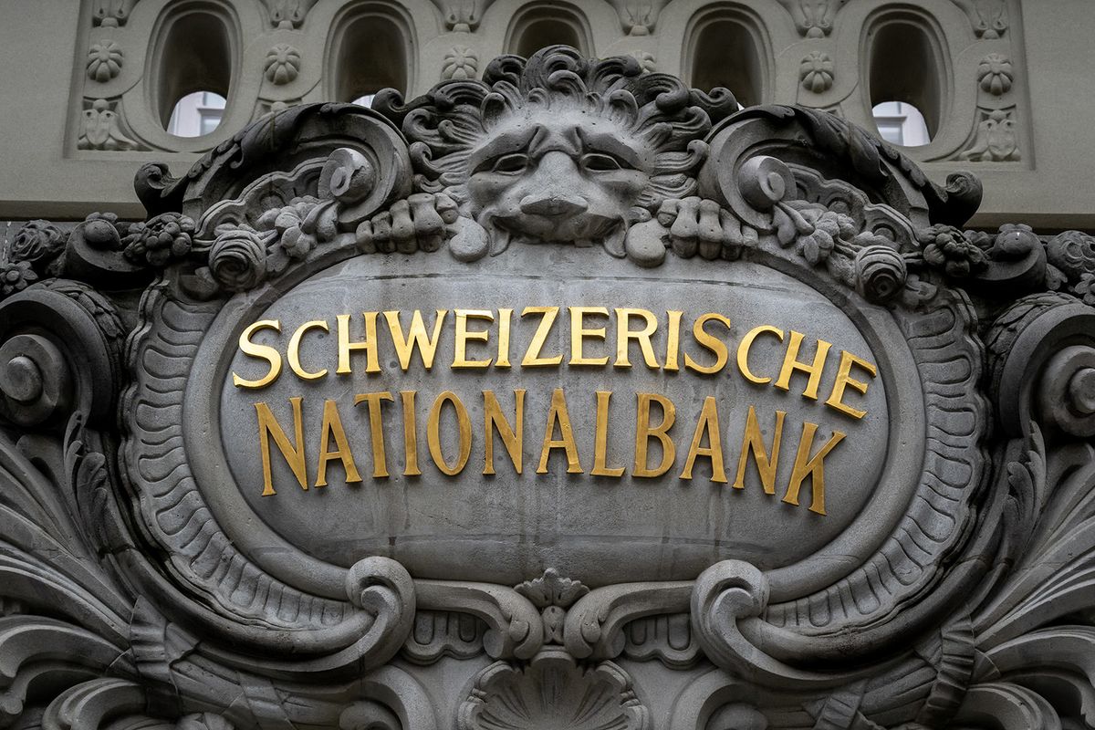 A sign of the Swiss National Bank (SNB) is seen on its headquarters ahead of a press conference in Bern on December 15, 2022. The Swiss central bank on December 15, 2022 raised its key interest rate by 50 basis points to 1%, continuing to tighten monetary policy despite the recent deceleration in Swiss inflation. (Photo by Fabrice COFFRINI / AFP)