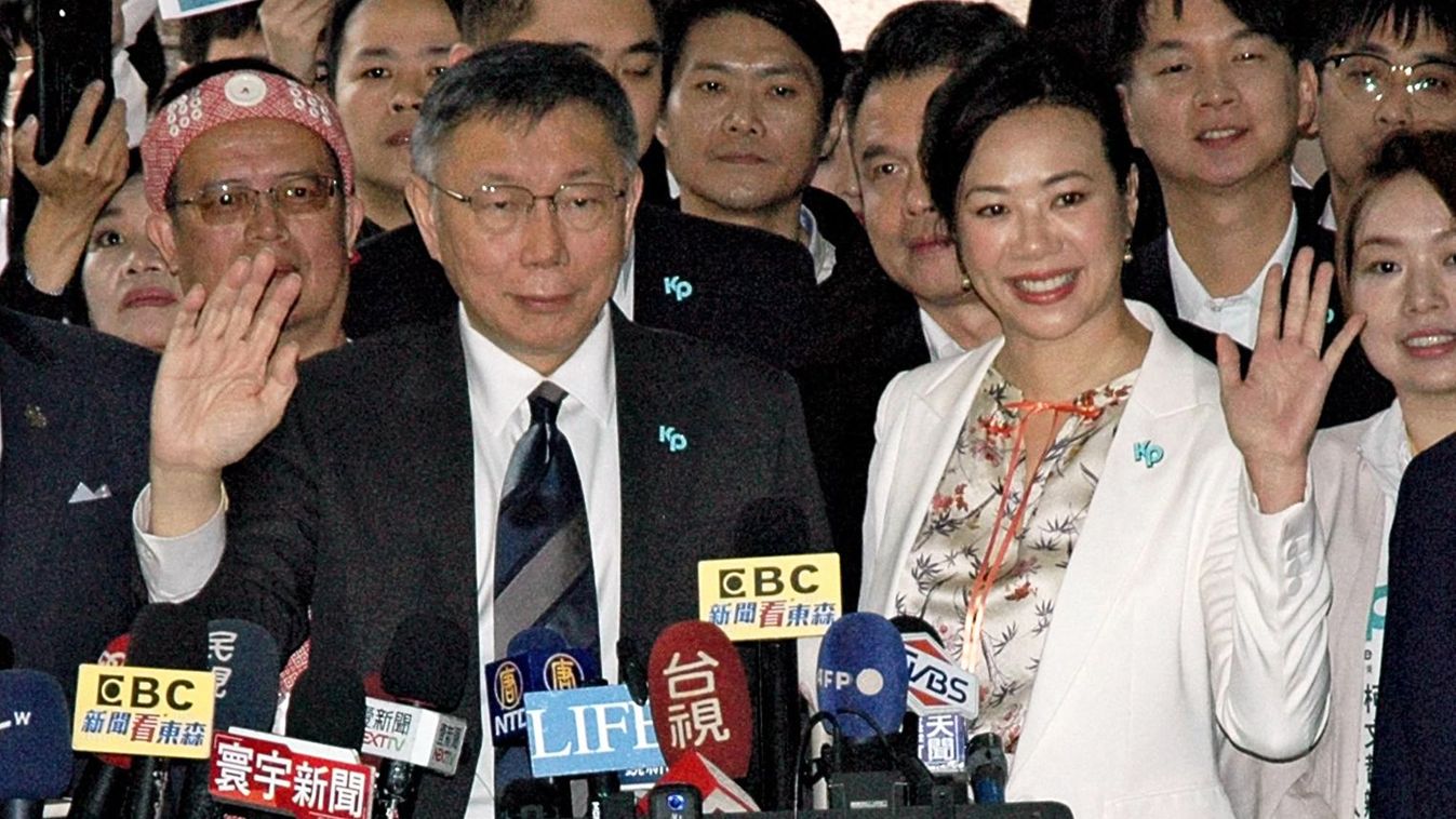 Taiwan Presidential ElectionKo Wen-je (L), chairman of the Taiwan People's Party (TPP) and presidential candidate, and his running mate Cynthia Wu wave their hands after they registered for the upcoming 2024 presidential elections in Taipei on Nov. 24, 2023. ( The Yomiuri Shimbun ) (Photo by Masatsugu Sonoda / Yomiuri / The Yomiuri Shimbun via AFP)