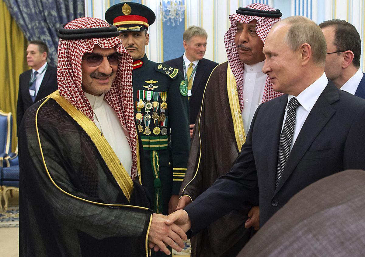 A handout picture provided by the Saudi Royal Palace shows Russian President Vladimir Putin shaking hands with Saudi Prince Walid bin Talal bin Abdulaziz Al Saud (L) in Riyadh, Saudi Arabia, on October 14, 2019. (Photo by Bandar AL-JALOUD / Saudi Royal Palace / AFP) / RESTRICTED TO EDITORIAL USE - MANDATORY CREDIT "AFP PHOTO / SAUDI ROYAL PALACE / BANDAR AL-JALOUD" - NO MARKETING - NO ADVERTISING CAMPAIGNS - DISTRIBUTED AS A SERVICE TO CLIENTS