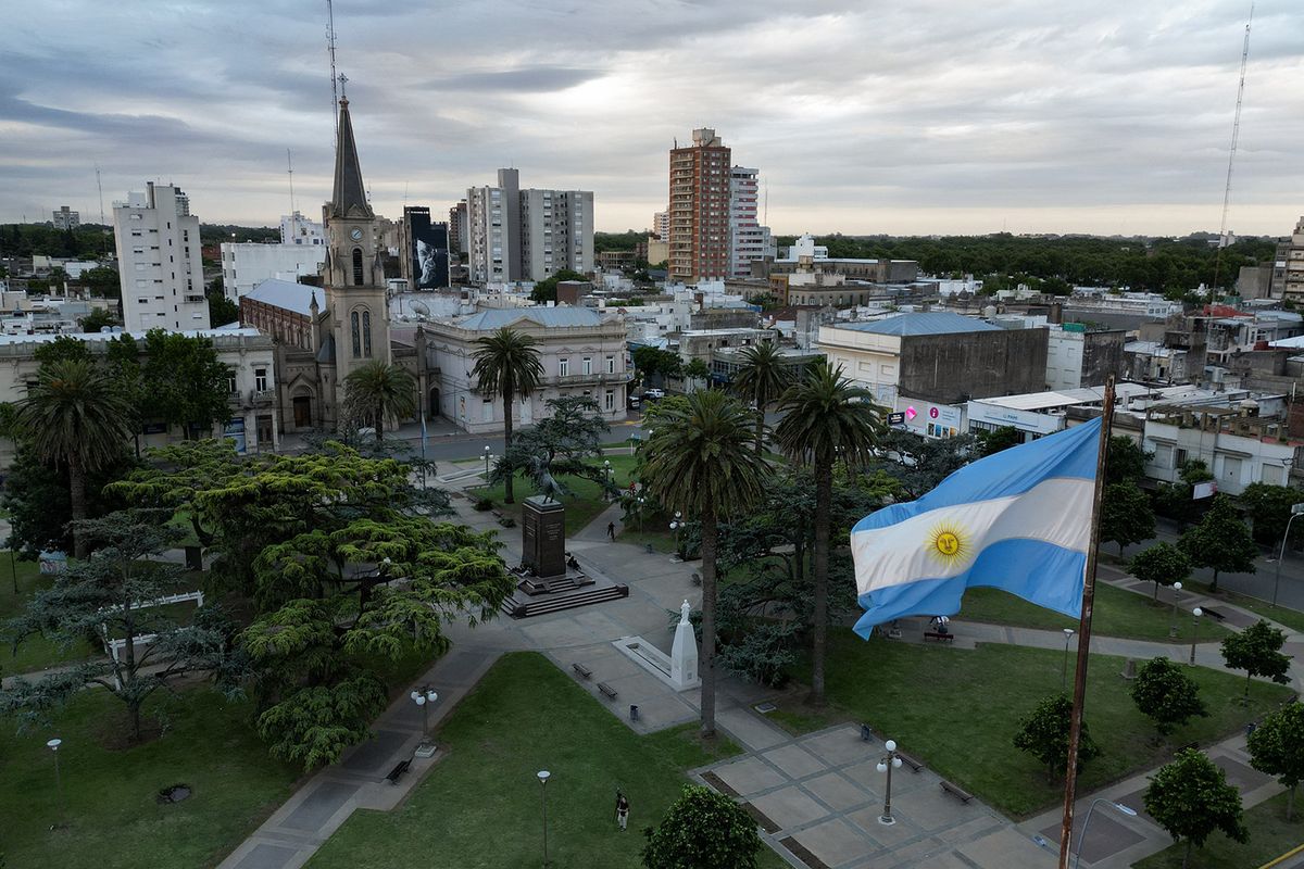 Aerial view showing the Argentine flag fluttering in the wind in Junin, Buenos Aires Province, Argentina, on November 13, 2023. The countryside, the source of Argentina's wealth though with little political influence, goes to the presidential ballot uncomfortable. Argentina's Economy Minister Sergio Massa and anti-establishment outsider Javier Milei will face off in a runoff presidential election on November 19, 2023, a battle between two wildly different versions of the country. (Photo by Luis ROBAYO / AFP)