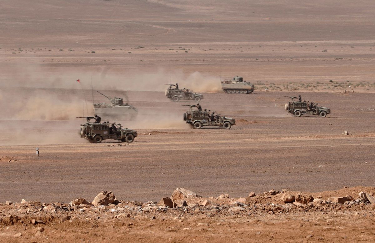 A handout picture released by the Jordanian Royal Palace on October 29, 2018 shows members of Jordan's Armed Forces-Arab Army attending a tactical exercise conducted by the 60th Prince El Hassan bin Talal Royal Armoured Brigade at a base in Zarqa, east of Amman. (Photo by Yousef ALLAN / Jordanian Royal Palace / AFP) / RESTRICTED TO EDITORIAL USE - MANDATORY CREDIT "AFP PHOTO / JORDANIAN ROYAL PALACE / YOUSEF ALLAN" - NO MARKETING NO ADVERTISING CAMPAIGNS - DISTRIBUTED AS A SERVICE TO CLIENTS