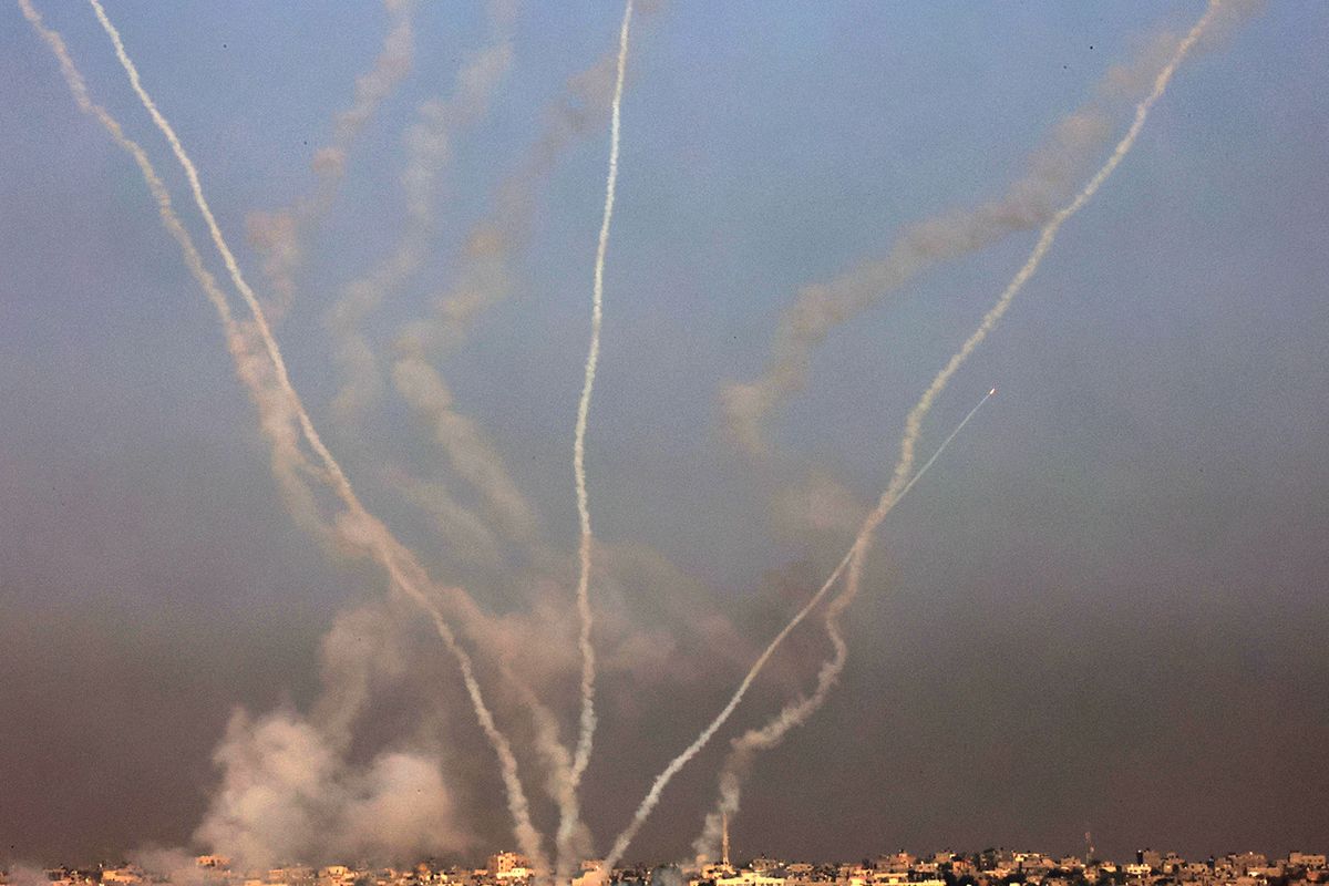 This picture taken from the southern Gaza Strip shows a salvo of rockets fired towards Israel on December 4, 2023, amid continuing battles between Israel and the Palestinian militant group Hamas. Israel has expanded its ground war on Hamas into the south of Gaza, witnesses said on December 4, despite global concern over mounting civilian deaths and fears the conflict will spread elsewhere in the Middle East. (Photo by SAID KHATIB / AFP)