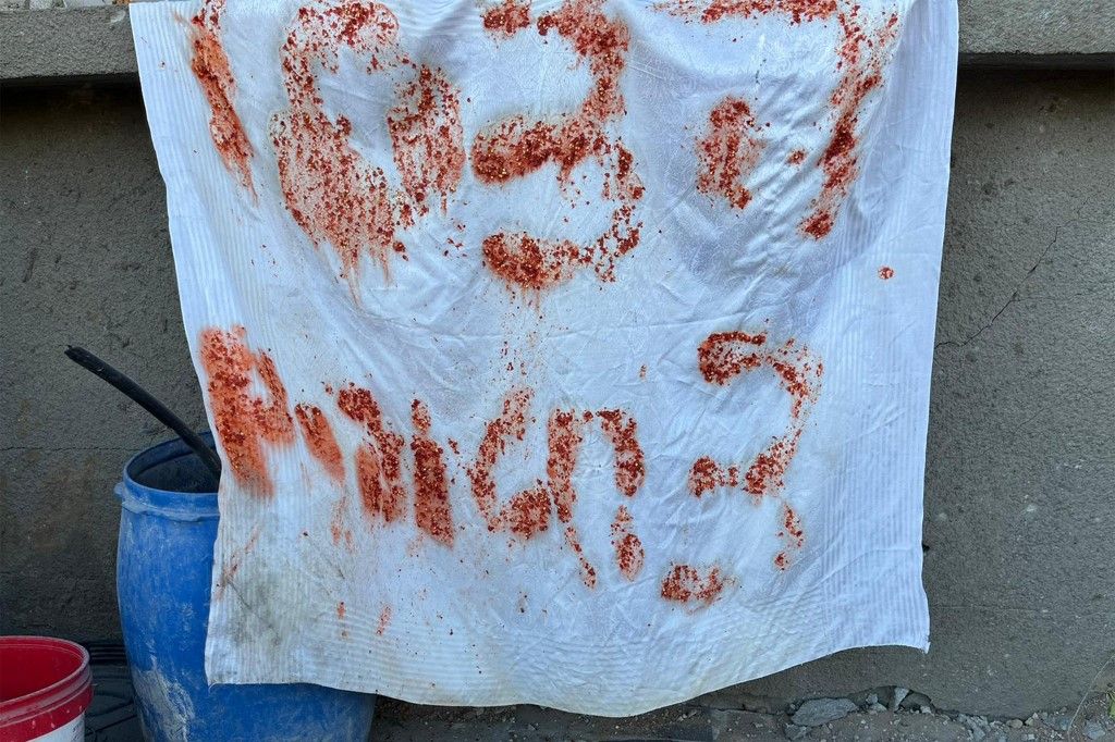 This handout picture released by the Israeli army on December 17, 2023 reportedly shows a makeshift sign reading in Hebrew "help, 3 hostages" using leftover food remains by by the three Israeli hostages who were mistakenly killed by Israeli forces, found after searches in a building adjacent to where the incident took place. The Israeli army said its troops shot and killed three Israeli hostages on December 15 in Shejaiya (a battleground neighbourhood of Gaza City), after "mistakenly" identifying them as a threat. (Photo by Israeli Army / AFP) / === RESTRICTED TO EDITORIAL USE - MANDATORY CREDIT "AFP PHOTO / Handout / Israeli Army' - NO MARKETING NO ADVERTISING CAMPAIGNS - DISTRIBUTED AS A SERVICE TO CLIENTS ==