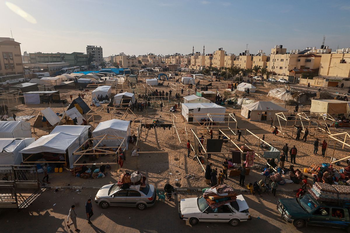 Displaced Palestinians fleeing central and southern Gaza set up tents in the new Tall el-Sultan camp west of Rafah in the southern Gaza Strip, on December 3, 2023, amid continuing battles between Israel and the militant group Hamas. (Photo by MOHAMMED ABED / AFP)