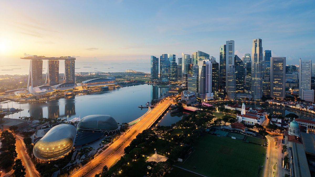 Aerial,View,Of,Singapore,Business,District,And,City,At,Twilight