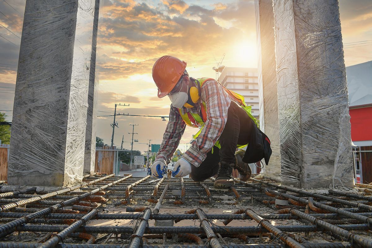 Worker,With,Contruction,Iron,Lines,For,Building,Foundation,construction,Worker