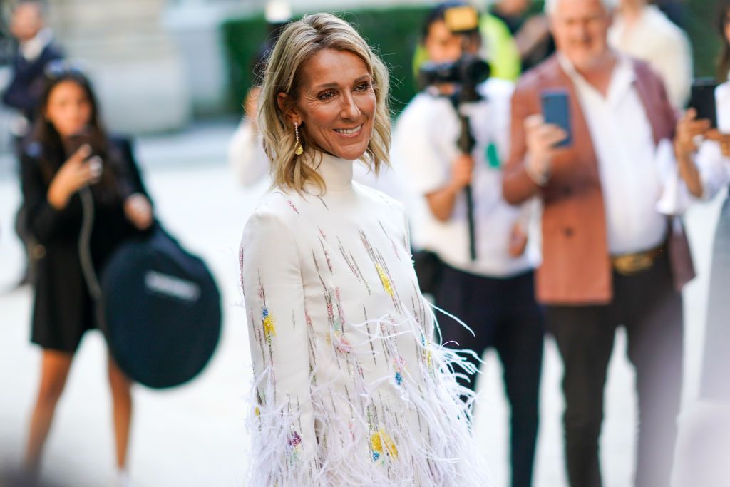 Street Style : Paris Fashion Week -Haute Couture Fall/Winter 2019/2020 : Day FourPARIS, FRANCE - JULY 03: Celine Dion wears a white fluffy dress with turtleneck, outside Valentino, during Paris Fashion Week -Haute Couture Fall/Winter 2019/2020, on July 03, 2019 in Paris, France. (Photo by Edward Berthelot/Getty Images)