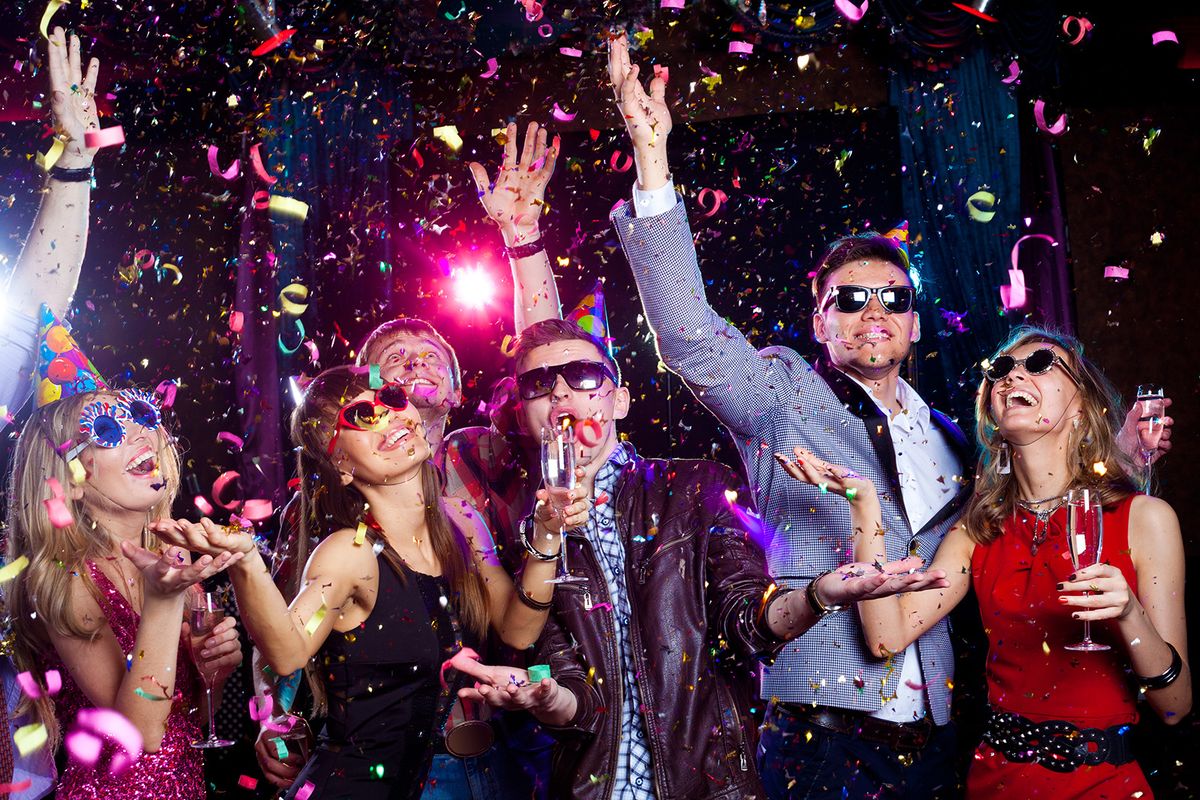 Cheerful,Young,People,Showered,With,Confetti,On,A,Club,Party.