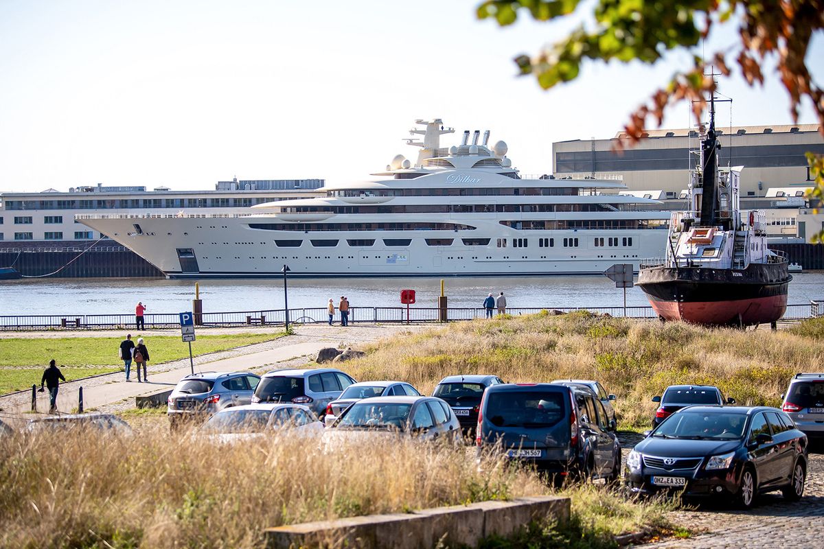 22 September 2022, Bremen: The luxury yacht "Dilbar" is moored at the Lürssen shipyard in Lemwerder, opposite Bremen's Vegesack district. She had been detained in April on the basis of EU sanctions due to the invasion of Ukraine by Russian troops. The ship has now been moved from Hamburg to the Weser under official supervision. Photo: Sina Schuldt/dpa (Photo by Sina Schuldt / DPA / dpa Picture-Alliance via AFP)