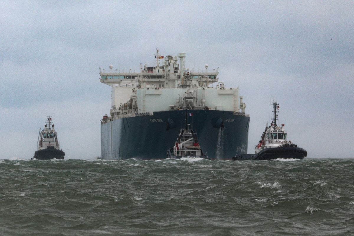 The TotalEnergies Cape Ann LNG tanker ship, escorted by maritime gendarmerie, arrives at the northern French port city of Le Havre, in the English Channel on September 18, 2023. (Photo by LOU BENOIST / AFP)