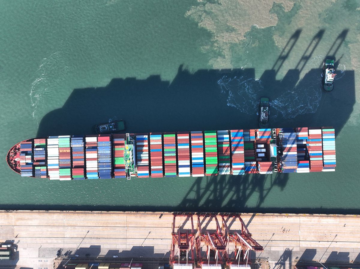 The COSCO Shipping container ship ''Lotus'' is preparing to dock at a container terminal to unload cargo in Lianyungang, Jiangsu province, China, on December 8, 2023. The vessel is 366 meters long, 48.2 meters wide, and has a carrying capacity of 143,179 tons, making it the largest container ship in the port this year. (Photo by Costfoto/NurPhoto) (Photo by CFOTO / NurPhoto / NurPhoto via AFP)