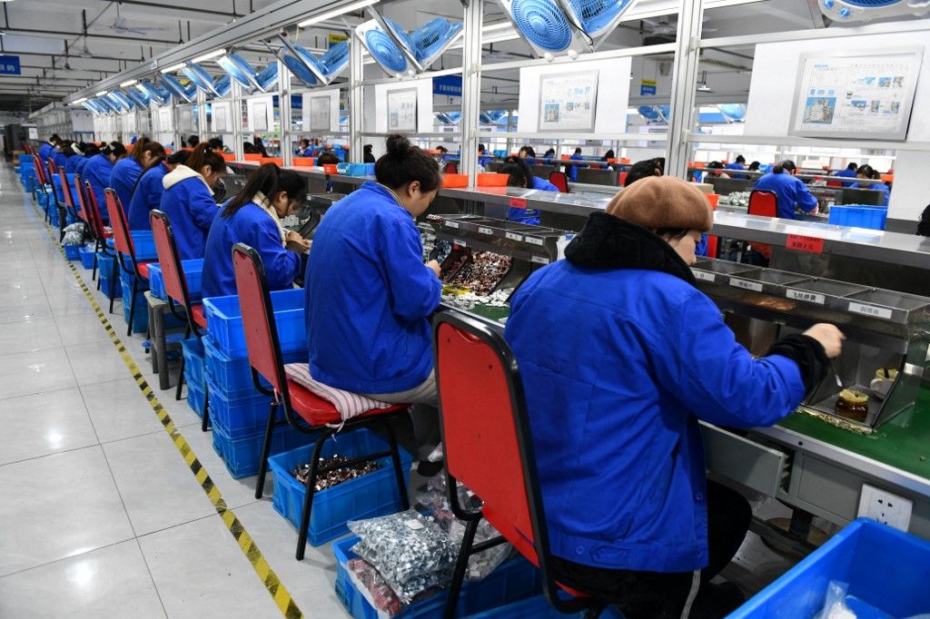 China Economy Expected to Grow By 5.2% in 2023Workers are working on a circuit breaker production line at a workshop of an electric company in Fuyang, China, on January 16, 2024. (Photo by Costfoto/NurPhoto) (Photo by CFOTO / NurPhoto / NurPhoto via AFP)