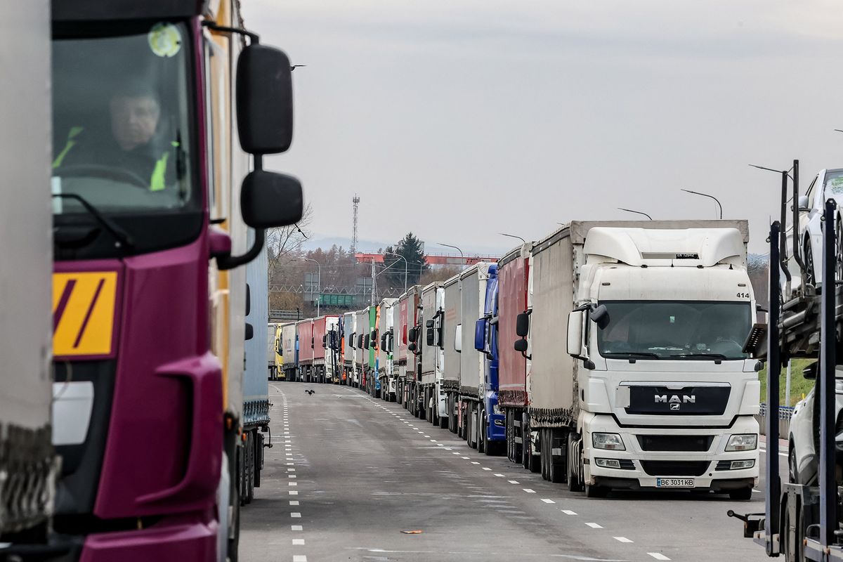 Polish Farmers S Block Another Border Crossing With Ukraine
TRucks stand in a queue to cross the border in Medyka as Polish farmers start a strike to block truck transport in Medyka - border crossing between Poland and Ukraine, on November 23, 2023. The farmers joined the transport sector in the strike against poor management of agricultural imports of Ukrainian produce as well as demand renegotiation of transport deals between Ukraine and the European Union. Medyka is the fourth strike site. Protesters already blocked 3 other crossings for truck transport, allowing only 4 trucks per an hour excluding humanitarian and military aid and sensitive chemical and food goods. According to the drivers, the queue to the Medyka crossing was nearly 7 days even before the strike started today. (Photo by Dominika Zarzycka/NurPhoto) (Photo by Dominika Zarzycka / NurPhoto / NurPhoto via AFP)