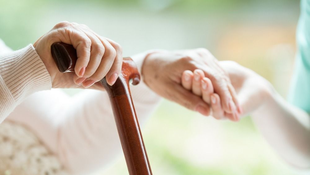 Closeup,Of,Elderly,Lady,Holding,Walking,Cane,In,One,Hand