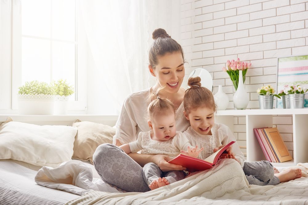 Happy,Loving,Family.,Pretty,Young,Mother,Reading,A,Book,To