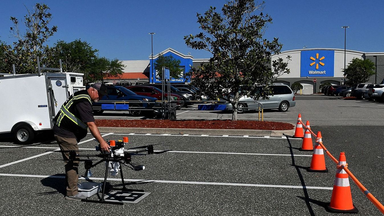 CLERMONT, FLORIDA, UNITED STATES - MARCH 30: Flight engineer Brian Scoles performs a pre-flight inspection of a delivery drone at the DroneUp hub in the parking lot at the Walmart Supercenter in Clermont, Florida, United States on March 30, 2023. Walmart customers who live within one mile of the store can have certain items weighing up to 10 pounds delivered to their home by drone within 30 minutes for a $3.99 fee. Paul Hennesy / Anadolu Agency (Photo by Paul Hennesy / ANADOLU AGENCY / Anadolu via AFP)