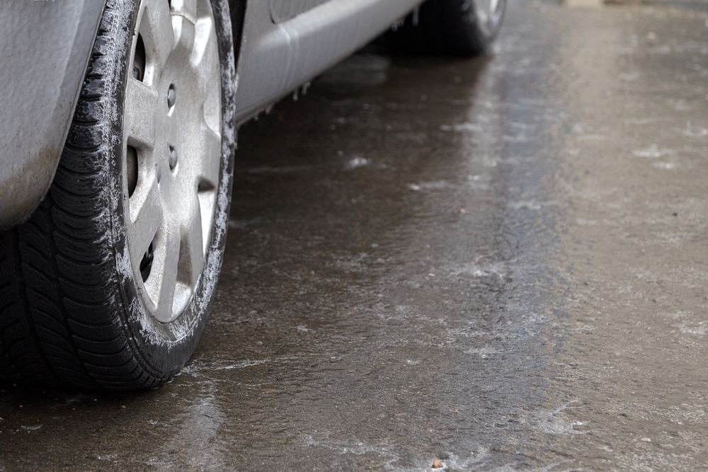 Ice,Crusted,Ground,,Car,Wheel,On,Icy,Road,,Hazardous,Weather