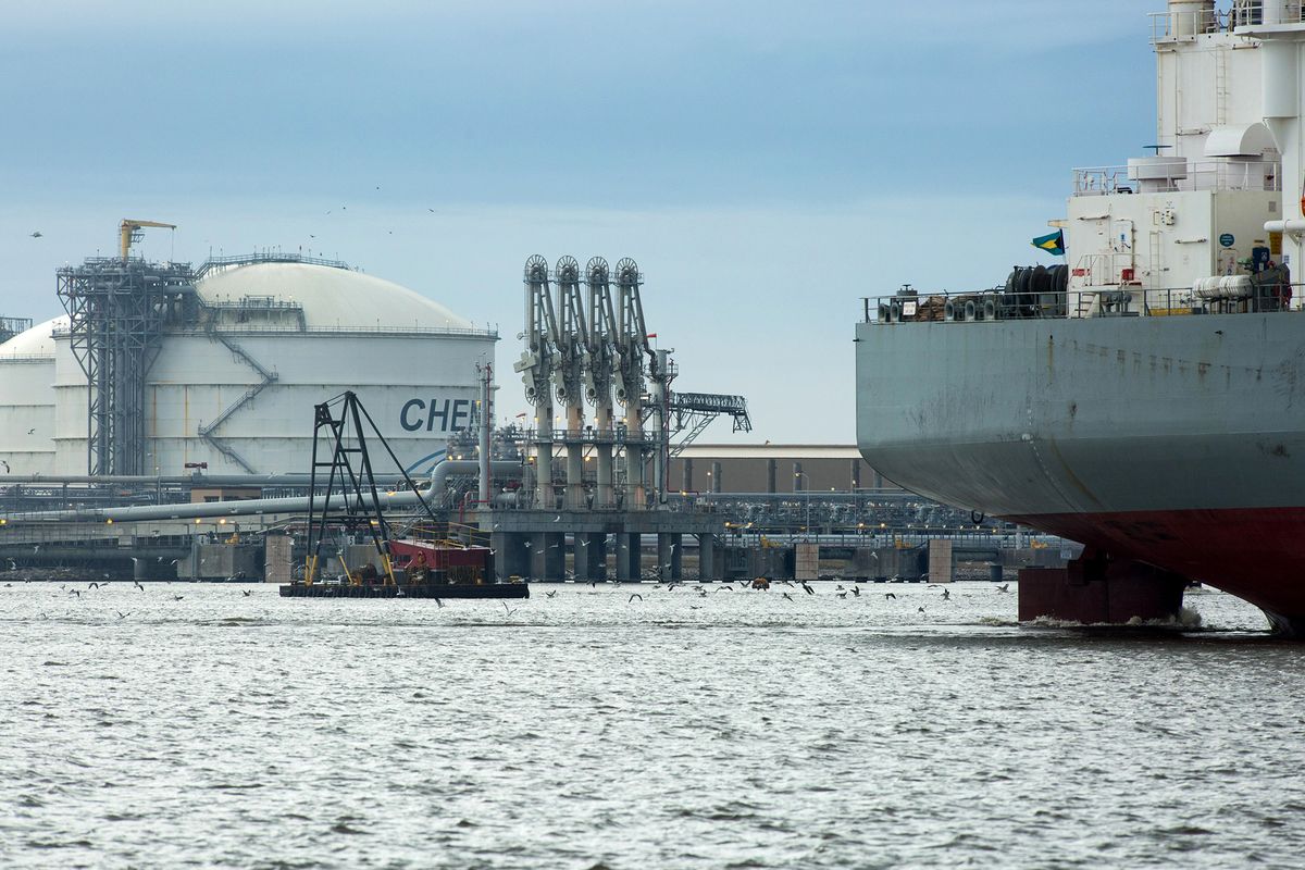 Cheniere Energy Inc.'s Liquified Natural gas (LNG) Terminal As The U.S. Prepares For First Shale Exports
The Amazon Brilliance oil tanker, right, sails past a storage tank, left, at the Cheniere Energy Inc. liquefied natural gas (LNG) terminal in Sabine Pass, Louisiana, U.S., on Thursday, Jan. 14, 2016. Cheniere Energy Inc. said its first cargo of LNG from its new Louisiana export terminal will be delayed by as much as two months because of faulty wiring. Photographer: F. Carter Smith/Bloomberg via Getty Images
