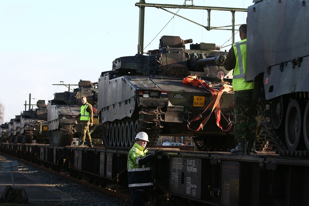 Military vehicles are loaded on a train in Steenwijk, the Netherlands, on January 11, 2017, to be transported to Poland where the Netherlands will take part in a major military exercise with Germany, Poland, Estonia, Canada and USA. (Photo by Vincent Jannink / ANP / AFP) / Netherlands OUT