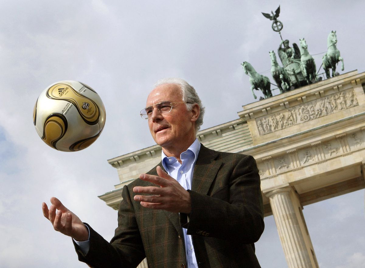 Franz Beckenbauer is dead
FILED - 18 April 2006, Berlin: The President of the 2006 World Cup Organizing Committee, Franz Beckenbauer, presents the golden soccer for the 2006 World Cup final in front of the Brandenburg Gate. Franz Beckenbauer is dead. The German soccer legend died on Sunday at the age of 78, his family told the German Press Agency on Monday. Photo: Peer Grimm/dpa (Photo by PEER GRIMM / DPA / dpa Picture-Alliance via AFP)