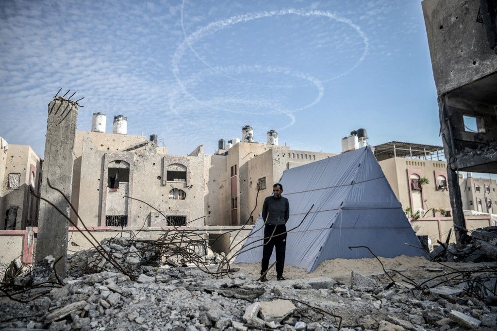 Palestinian lives in tent built on rubble in Rafah