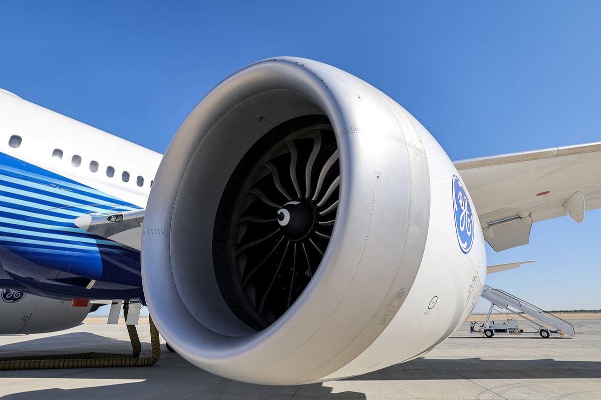 This picture taken on November 13, 2023 shows a view of one of the General Electric-built engines of a Boeing 777-9 jetliner aircraft on the tarmac during the 2023 Dubai Airshow at Dubai World Central - Al-Maktoum International Airport in Dubai. (Photo by Giuseppe CACACE / AFP)