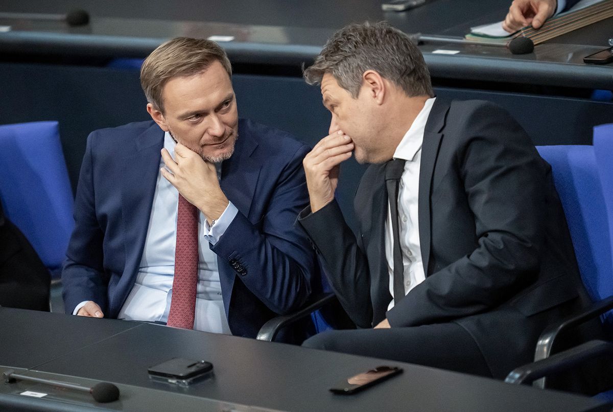 13 December 2023, Berlin: Christian Lindner (l, FDP), Federal Minister of Finance, speaks with Robert Habeck (Alliance 90/The Greens), Federal Minister of Economics and Climate Protection, during the Bundestag session with the Federal Chancellor's government statement. During the night, the parties of the traffic light coalition agreed on a federal budget for the year 2 2024. Photo: Michael Kappeler/dpa (Photo by MICHAEL KAPPELER / DPA / dpa Picture-Alliance via AFP)