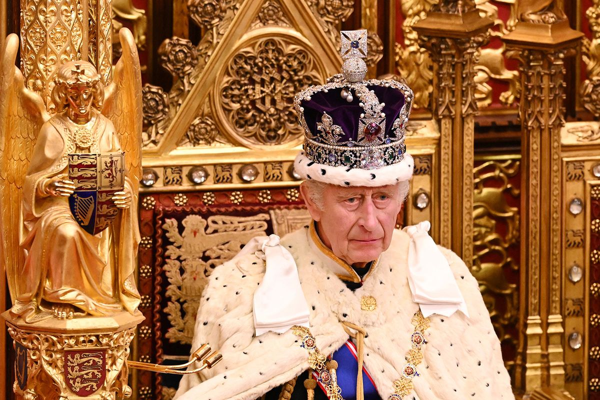 (FILES) Britain's King Charles III, wearing the Imperial State Crown and the Robe of State, sits on The Sovereign's Throne in the House of Lords chamber, during the State Opening of Parliament, at the Houses of Parliament, in London, on November 7, 2023. Britain's King Charles III is to receive hospital treatment for enlarged prostate, Buckingham Palace announced on January 17, 2024. (Photo by Leon Neal / POOL / AFP)