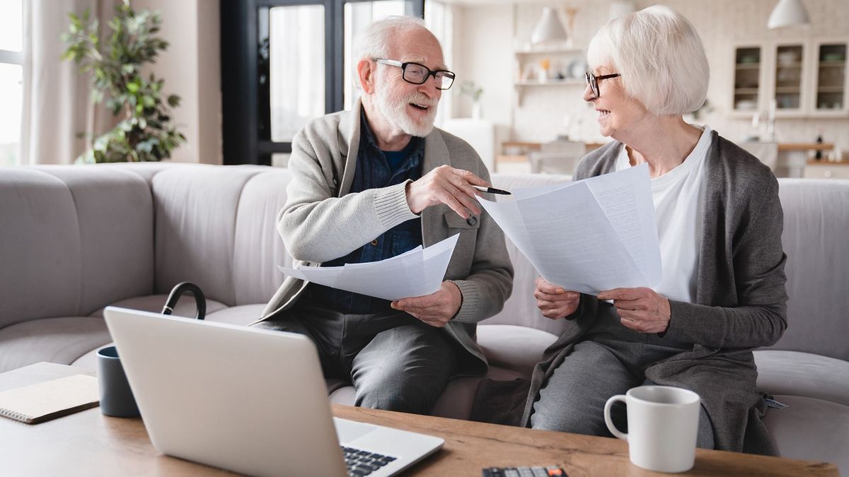Senior,Old,Elderly,Grandparents,Couple,Family,Wife,And,Husband,CountingSenior old elderly grandparents couple family wife and husband counting funds, savings declarations, investments,paperwork, financial documents, bankruptcy, court case, bills, pension with laptop.