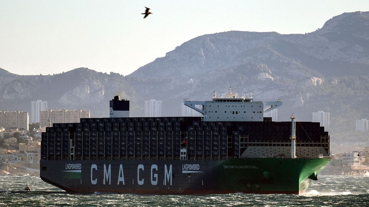 (FILES) The "CMA CGM Palais Royal", the world's largest container's ship powered by natural gas, sails in the bay of Marseille, southern France, on December 14, 2023. Ships belonging to CMA-CGM have returned to the Red Sea following attacks by Houthi rebels in Yemen, and those belonging to Maersk will do the same, the two shipping giants said on December 27, 2023. (Photo by Christophe SIMON / AFP)